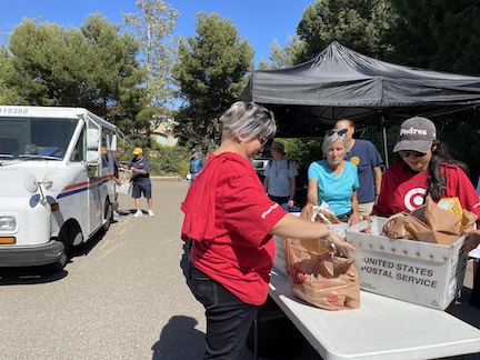 Volunteers sort food donations